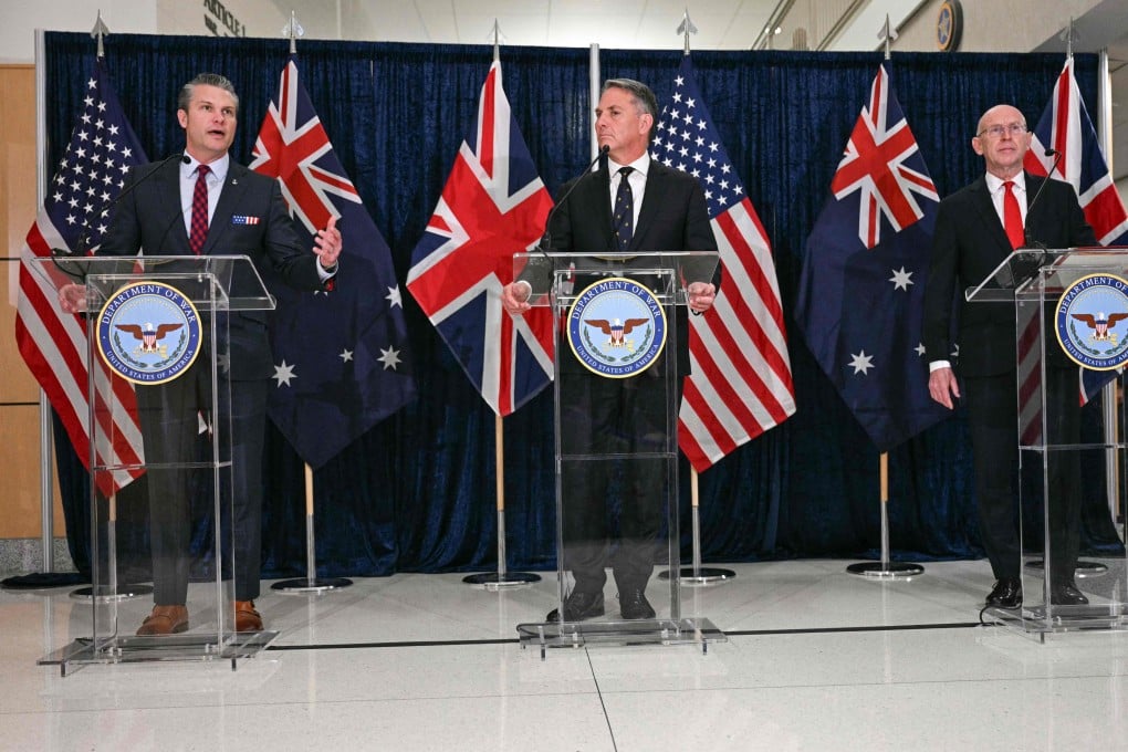US Secretary of Defence Pete Hegseth speaks as Australian Deputy Prime Minister and Defence Minister Richard Marles and British Defence Secretary John Healey look on during the Aukus meeting at the Pentagon in Washington, on December 10, 2025. Photo: AFP