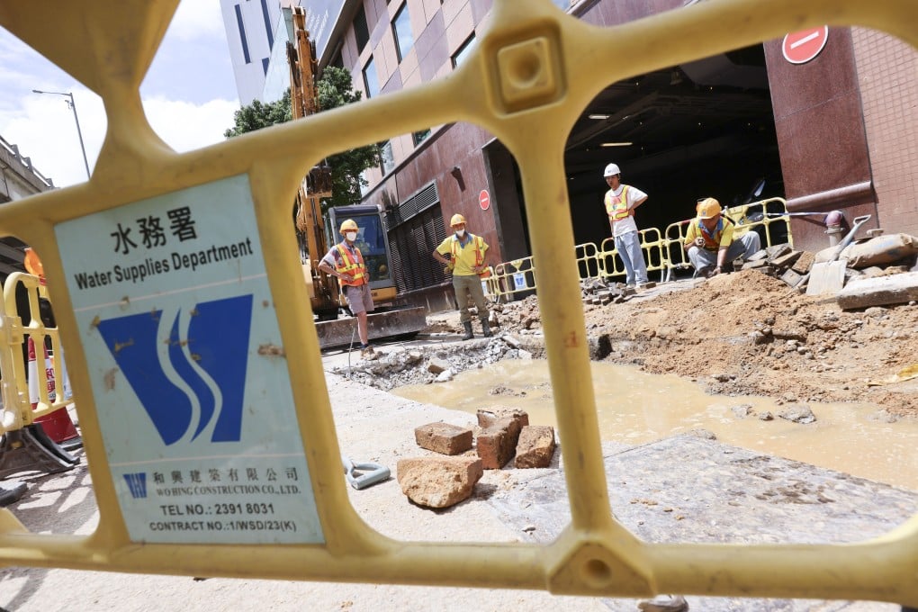 Repair workers contemplate a puddle along Gascoigne Road in Kowloon on June 12, 2025, following a saltwater leak. Photo: Jelly Tse