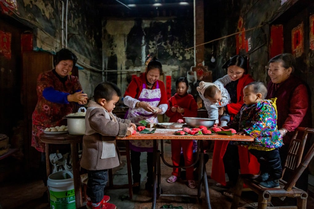 A family preparing red glutinous rice cakes for Chinese New Year in Putian, Fujian province, China. The photo was featured in the annual World Food Photography Awards. Photo: Chen Ying/World Food Photography Awards sponsored by Bimi