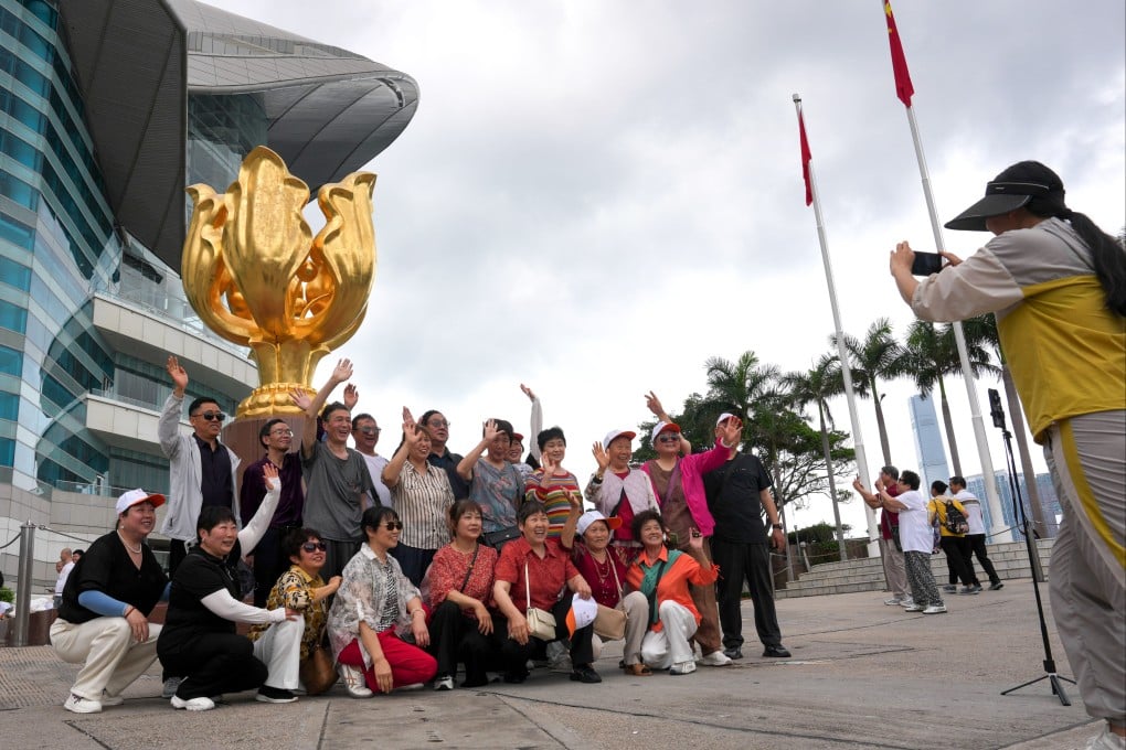 Tourists visiting Golden Bauhinia Square in Wan Chai. Photo: Jelly Tse