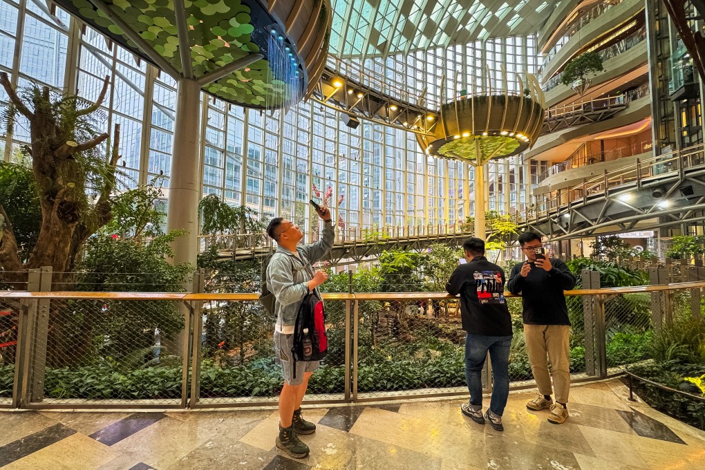Visitors enjoy the lush, futuristic interior of Chongqing’s The Ring Shopping Park, one of many new developments in China combining retail with expansive greenery and unique architectural features. Photo: Getty Images
