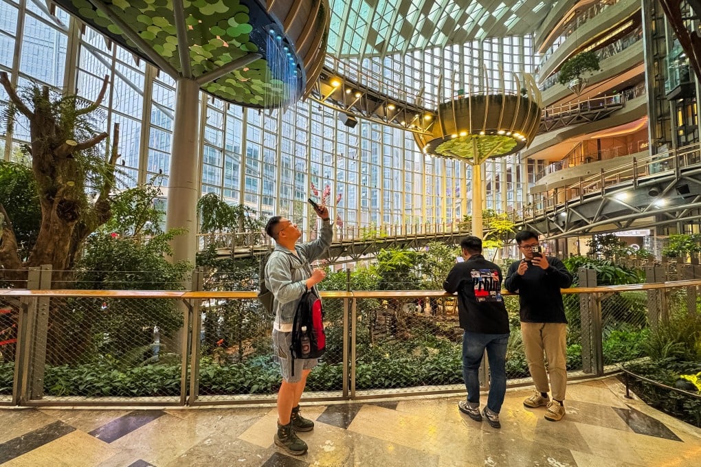 Visitors enjoy the lush, futuristic interior of Chongqing’s The Ring Shopping Park, one of many new developments in China combining retail with expansive greenery and unique architectural features. Photo: Getty Images