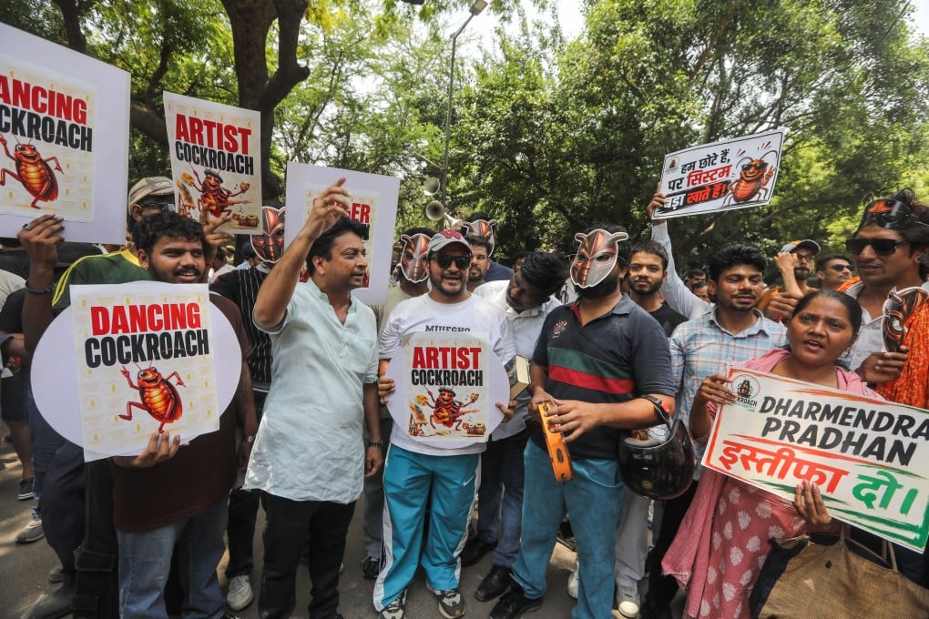 Supporters of the satirical youth movement Cockroach Janta Party hold placards during a protest in New Delhi, India, on Saturday. Photo: EPA