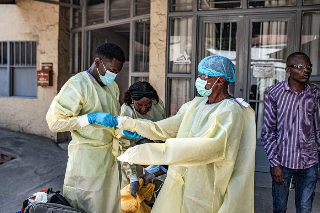 Medical workers put on protective suits in Goma, the Democratic Republic of the Congo, on Thursday. Photo: Xinhua via ZUMA Press/TNS