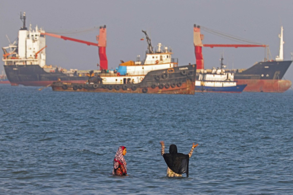 Iranians swim at Suru Beach in Bandar Abbas along the Strait of Hormuz on Monday. Photo: ISNA/AFP