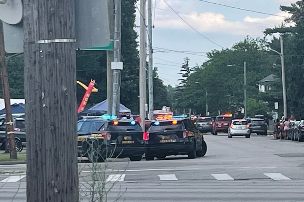 Police officers work at the scene of a shooting near a festival in Toledo, Ohio, on Saturday. Photo: WTVG via AP