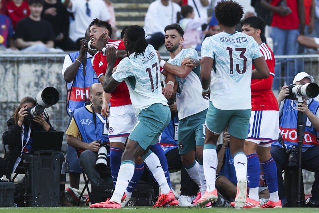 Portugal’s Rafael Leao and Chile’s Ivan Roman clash during their side’s World Cup warm-up at National Stadium, in Oeiras, Portugal. EPA