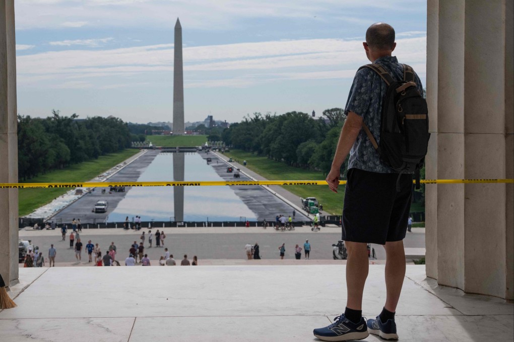 People walk past the Reflecting Pool on the National Mall on June 6, in Washington, as the Trump administration has repaints and cleans it ahead of the country’s 250th anniversary next month. Photo: Getty Images via AFP