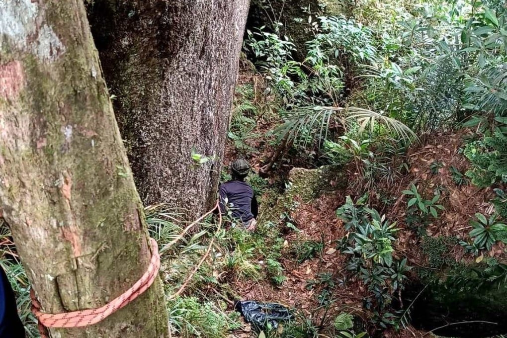 A Malaysian rescuer combs an area near Gunung Batu Putih mountain in Perak state. Photo: Facebook/BombaPerakofficial