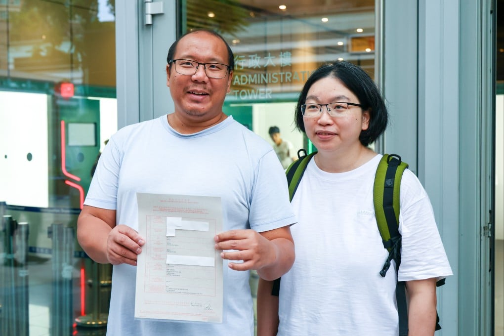 Tsang Wai-bong (left) and Kwan Pui-sin show off Danny’s birth certificate from the Immigration Department. Photo: Dickson Lee
