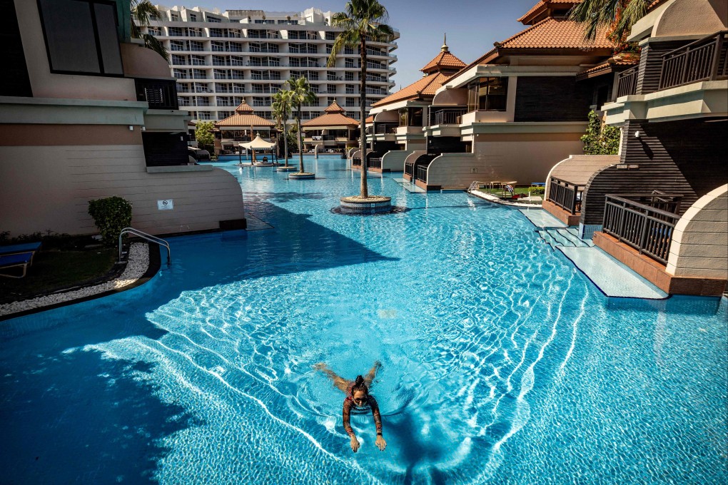 A woman swims in a pool at the Anantara The Palm Dubai Resort in the UAE on Saturday. Photo: AFP