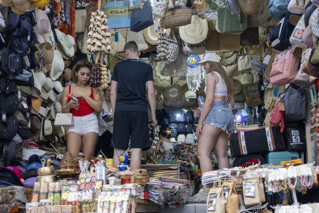 Tourists visit a shop in Ubud, Indonesia’s Bali, on Tuesday. Photo: EPA