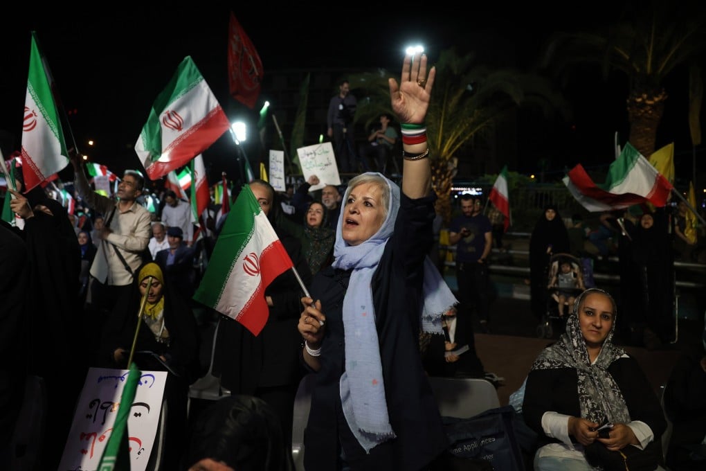 People gather in Tehran during a rally on Sunday following Iran’s attack on Israel. Photo: EPA/ABEDIN TAHERKENAREH