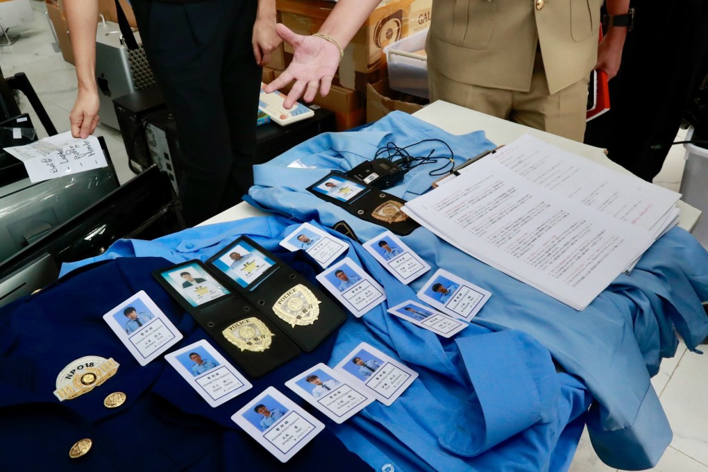 Cambodian authorities display equipment seized from a scam compound in Phnom Penh on March 11. Photo: EPA