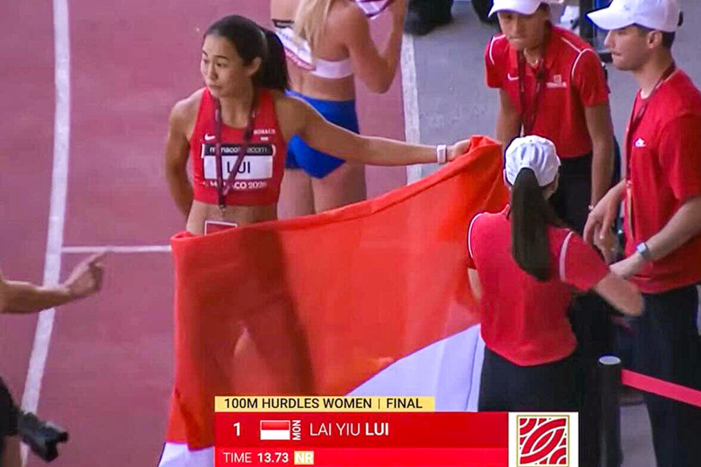 Hong Kong hurdler Vera Lui with a Monaco flag draped around her after winning the 100m hurdles event at the meet in Monaco last month. Photo: Handout
