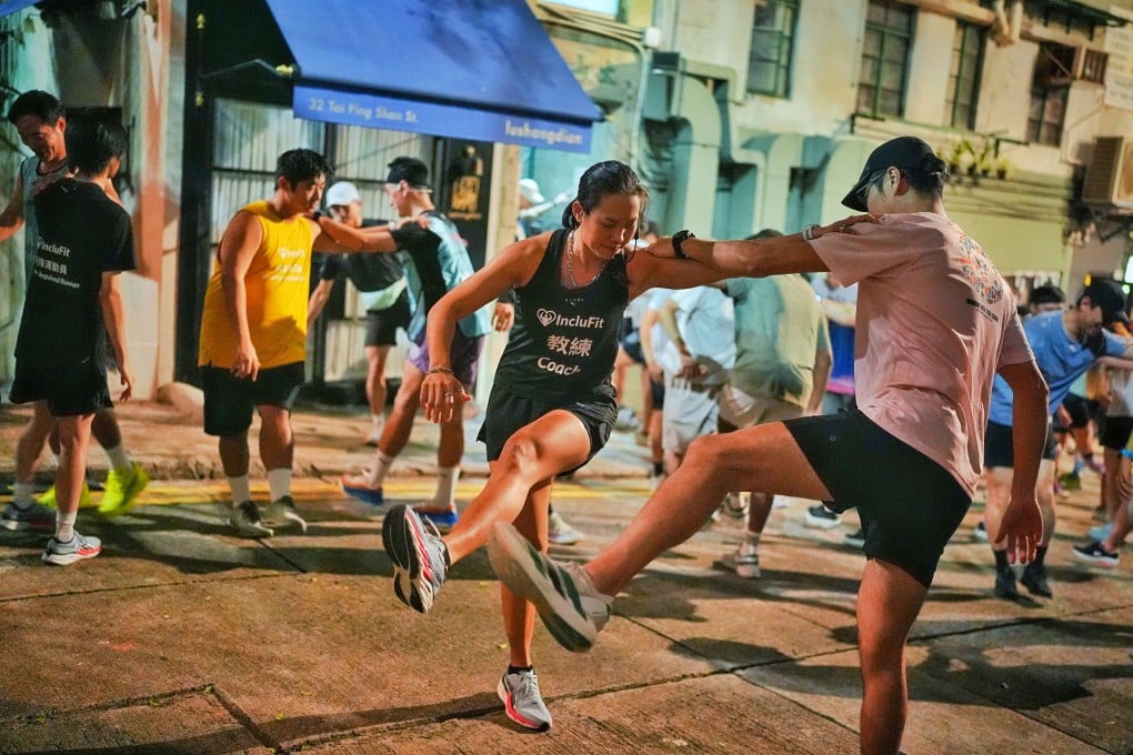 A night charity running event co-organised by Inclufit and Wazup Running Club starting from Tai Ping Shan Street. Photo: Elson Li