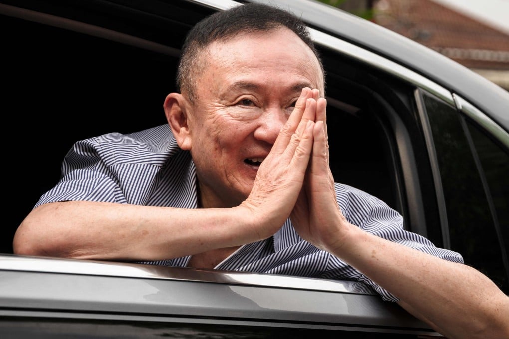 Former Thai prime minister Thaksin Shinawatra thanks supporters upon arriving back home after his release from Klong Prem Central Prison in Bangkok on May 11. Photo: AFP