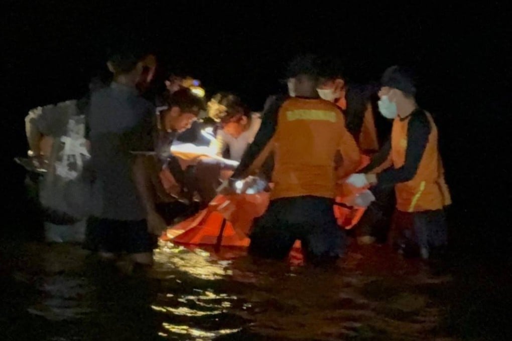 Rescuers recover Elmi Febrianti’s body from the sea off South Sulawesi, Indonesia, on Sunday in this still from a video. Photo: Andi Sultan