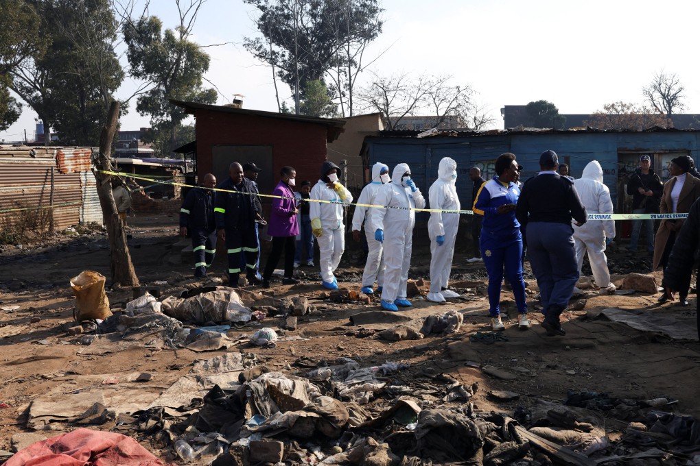 Forensics teams at the scene after the shootings. Photo: Reuters