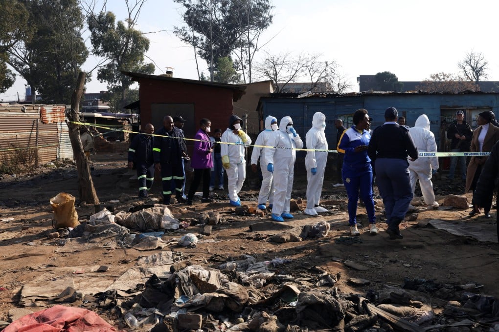 Forensics teams at the scene after the shootings. Photo: Reuters
