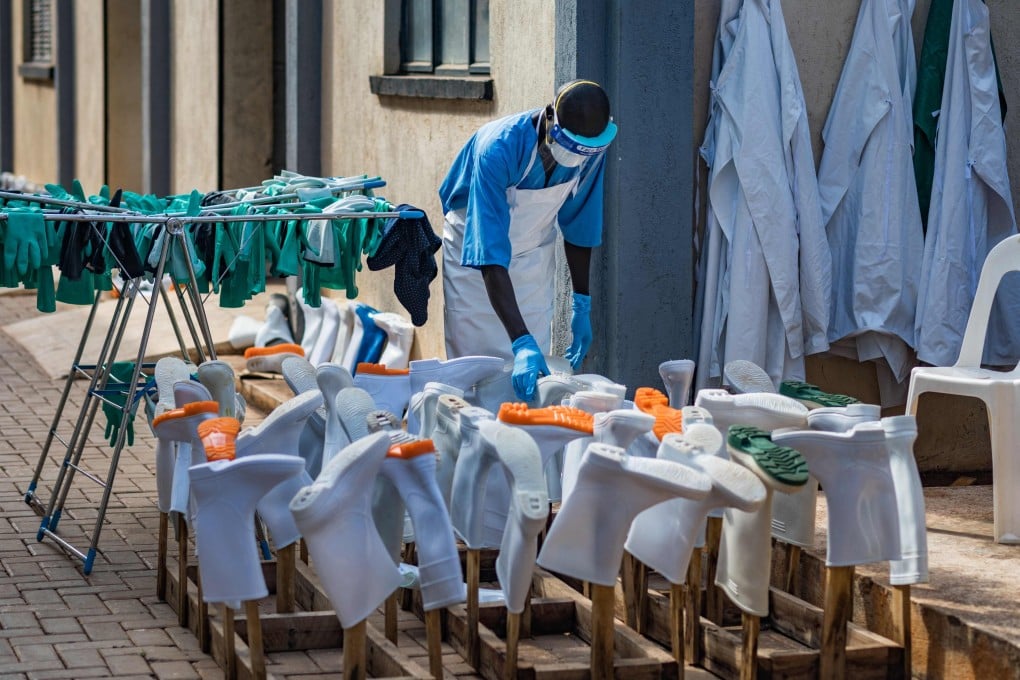 A health worker dries gumboots and gloves under the sun at the Mulago National Referral Hospital isolation unit in Kampala, Uganda, on Monday, amid the Ebola outbreak. Photo: AFP