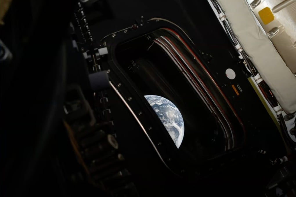 A view of Earth from inside the Orion capsule. The newly named Artemis III crew will remain in Earth's orbit next year to test high-stakes docking maneuvers with lunar landers. Photo: Nasa via AP