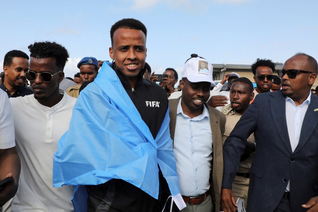 Somali referee Omar Artan (middle), who was denied entry to the US, arrives at the Aden Abdulle Osman International Airport in Mogadishu, Somalia on Tuesday. Photo: Reuters