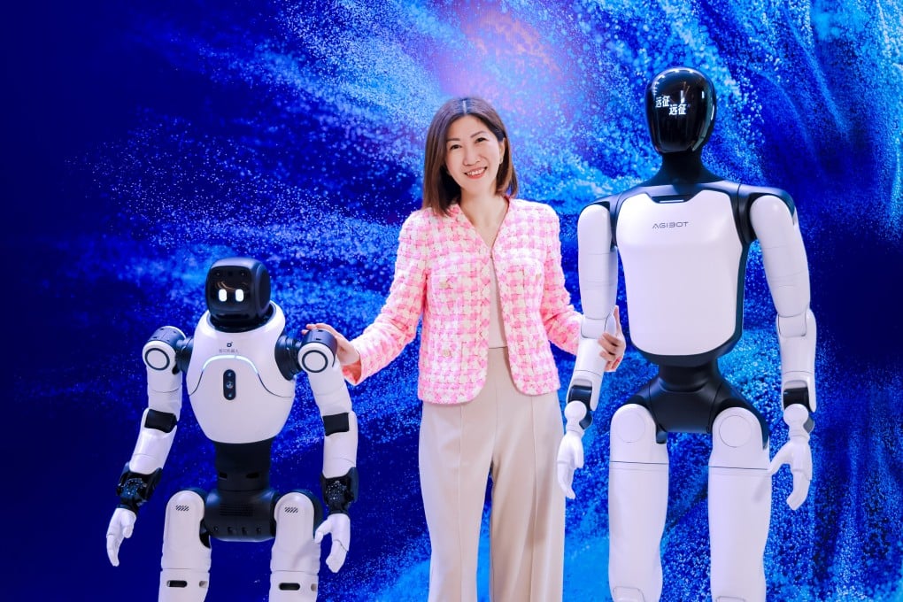 Bonnie Chan Yiting, CEO of Hong Kong Exchanges and Clearing, poses with humanoid robots at the bourse operator's Future Tech Summit in Shenzhen on Thursday. Photo: Handout