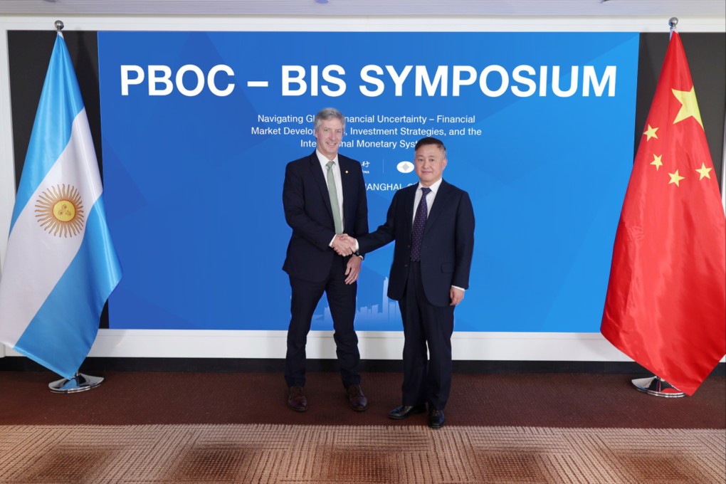 People’s Bank of China governor Pan Gongsheng (right) greets Santiago Bausili, the president of the Central Bank of Argentina, at the PBOC-BIS Symposium in Shanghai on Wednesday. Photo: Handout