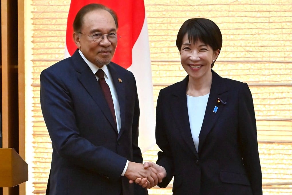 Japanese Prime Minister Sanae Takaichi (right) and her Malaysian counterpart, Anwar Ibrahim, shake hands at the end a joint press announcement at the Prime Minister’s Office in Tokyo on Wednesday. Photo: Reuters