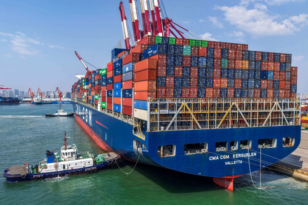 A container ship is moved to its berth at a port in China’s eastern Shandong province. Photo: AFP