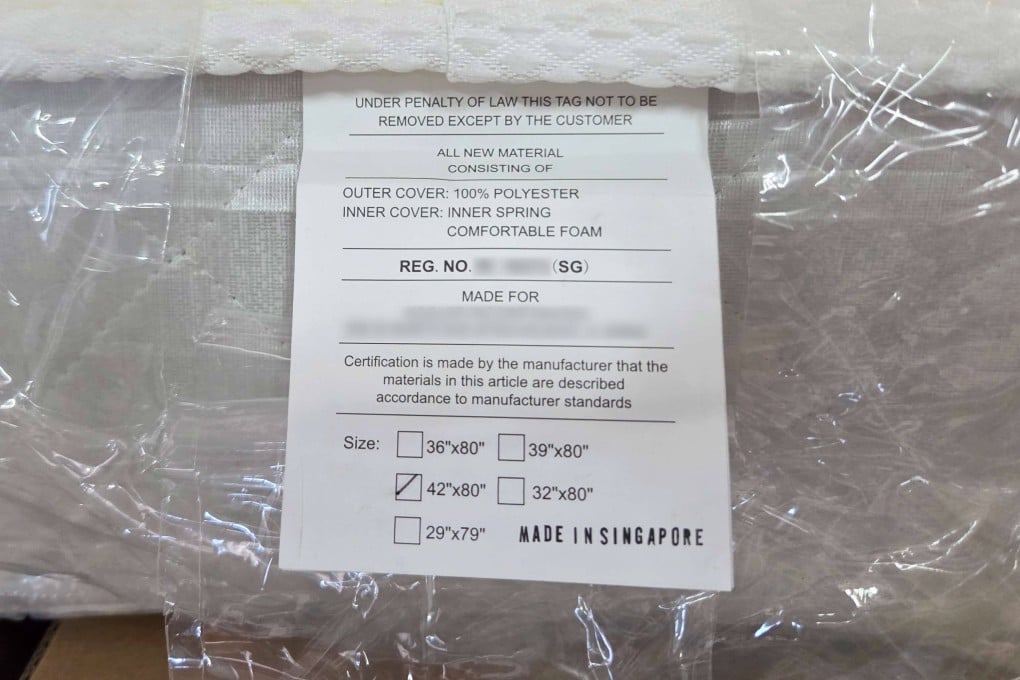 A seized mattress bears an allegedly falsified “Made in Singapore” stamp on its tag. Photo: Singapore Customs
