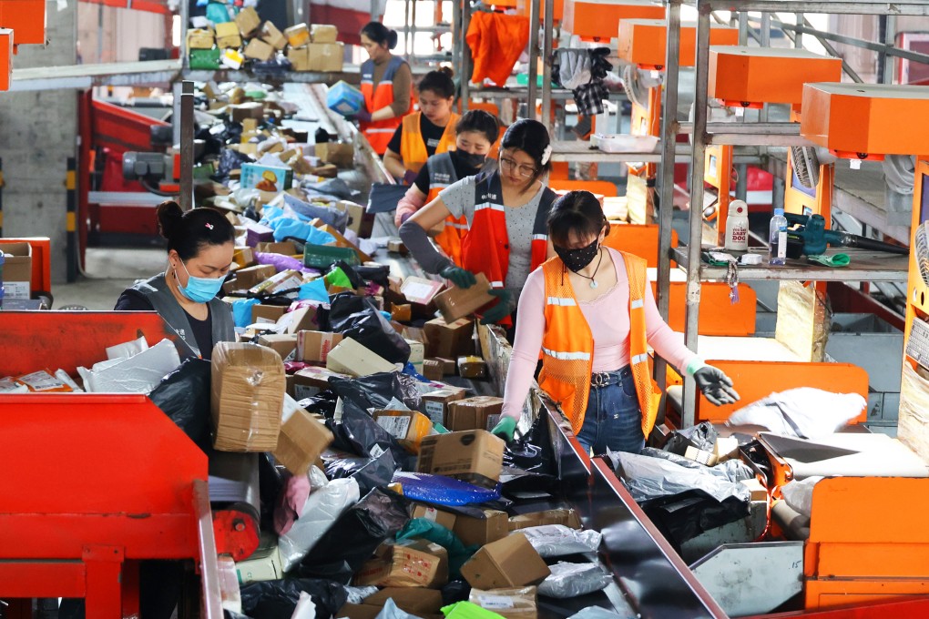 Workers sort express packages at a distribution centre in Lianyungang in China's Jiangsu Province. The express delivery industry is ramping up operations ahead of the  '618' online shopping festival. Photo: Getty Image
