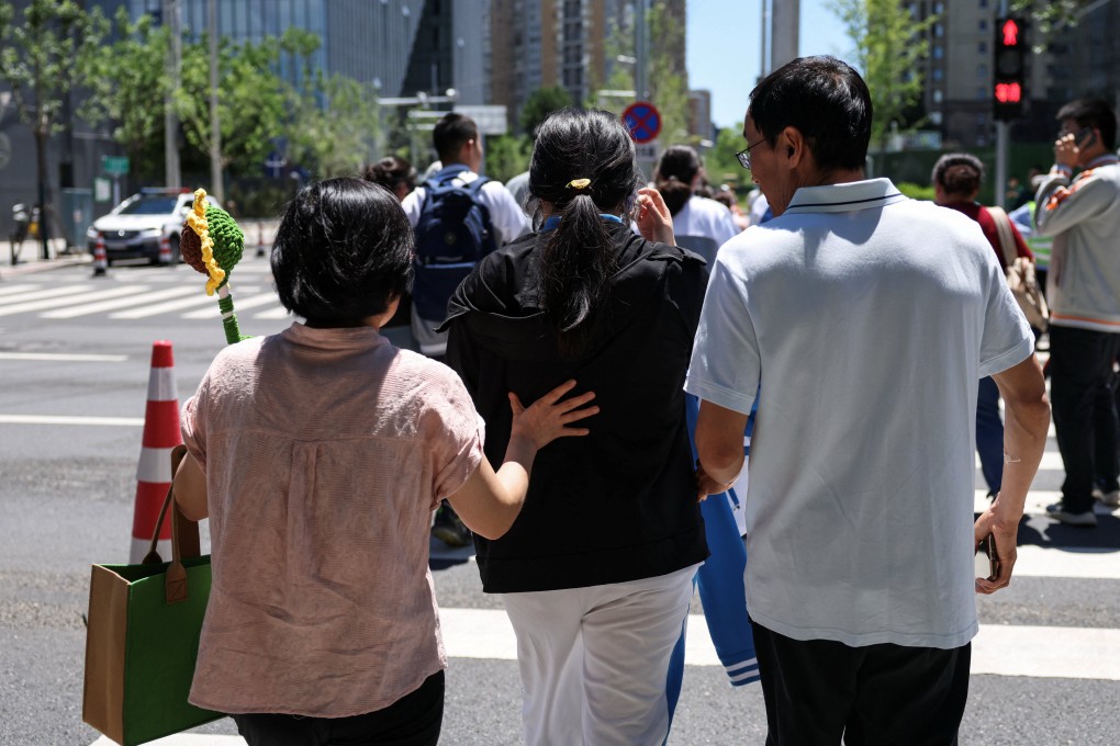 A woman is accompanied by her parents on her way to sit China’s national college entrance examination. Many women take contraceptives to delay their periods at this crucial time. Photo: Reuters