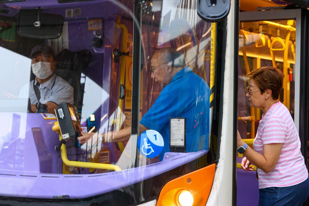 An elderly passenger taps his wallet to pay the fare when boarding a bus in Mong Kok on June 5. Photo: Dickson Lee