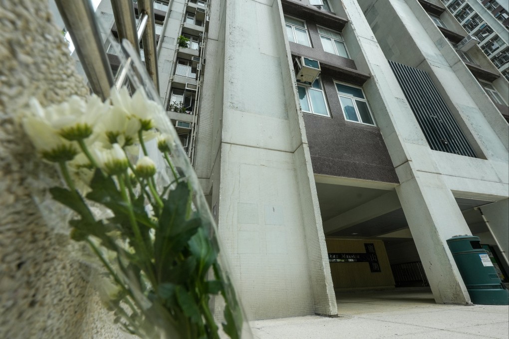 Flowers seen at Lu Shan Mansion, Taikoo Shing, where a 48-year-old mother and 12-year-old daughter fell to their deaths. Photo: Sun Yeung