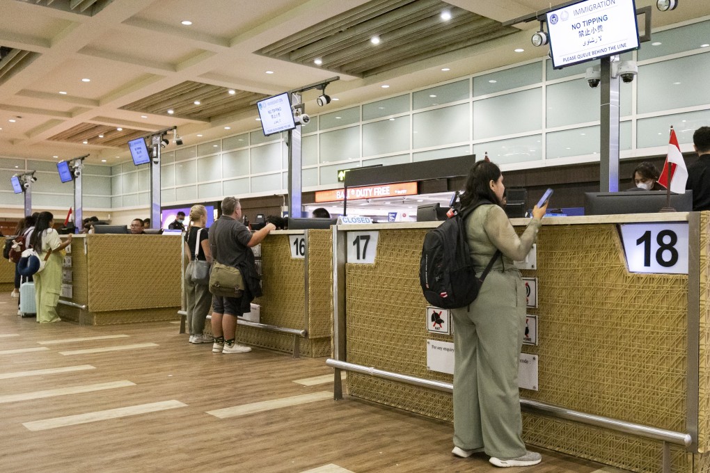 People queue up at immigration counters at the Ngurah Rai International Airport in Bali in February 2025. Photo: EPA-EFE