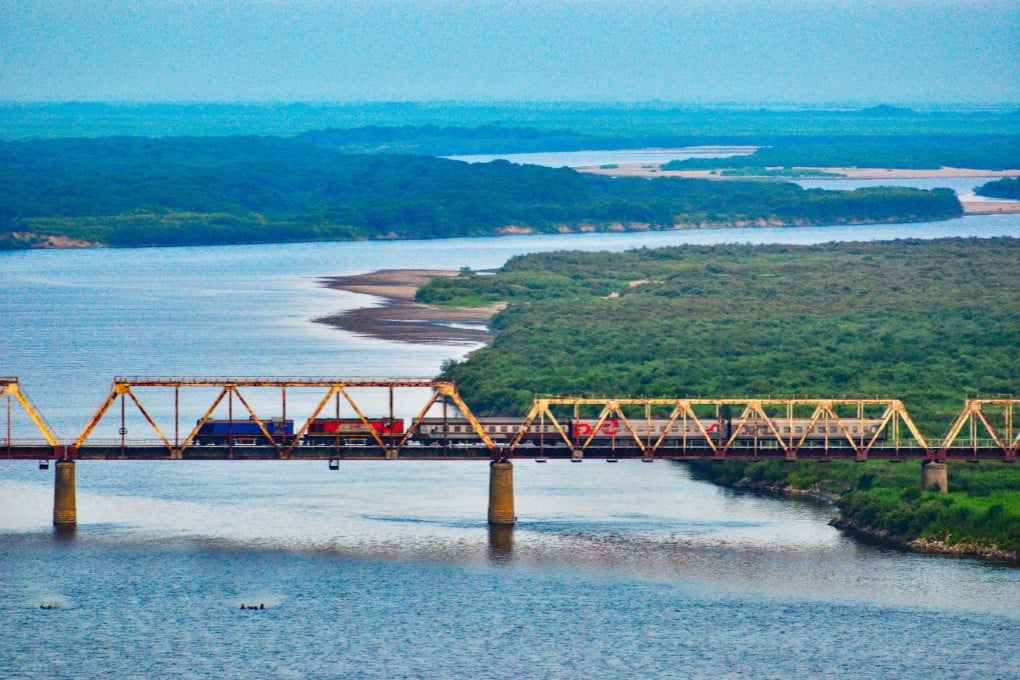 An international passenger train travels on the Korea–Russia Friendship Bridge across the Tumen River. Photo: Handout