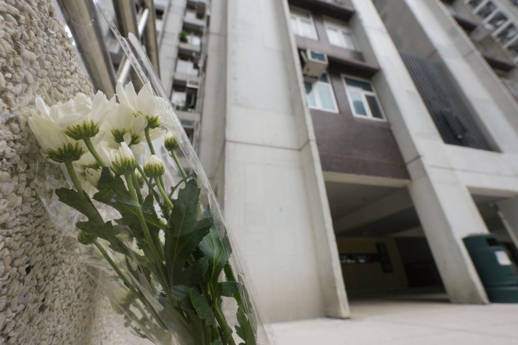 Flowers are seen outside Lu Shan Mansion in Taikoo Shing on June 12. A mother and her 12-year-old daughter fell from the same flat hours apart on June 10, raising concerns over level of mental support. Photo: Sun Yeung