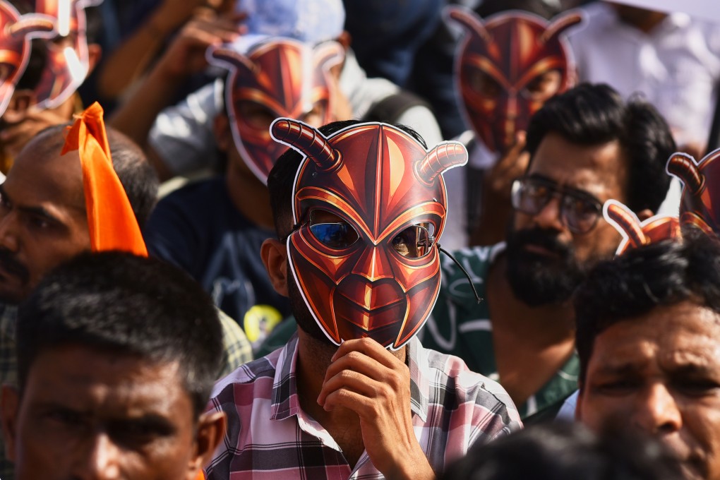 A participant wearing a cockroach mask takes part in a nationwide protest campaign launched by Abhijeet Dipke, founder of the Cockroach Janta Party, in Pune, India, on Thursday. Photo: AP