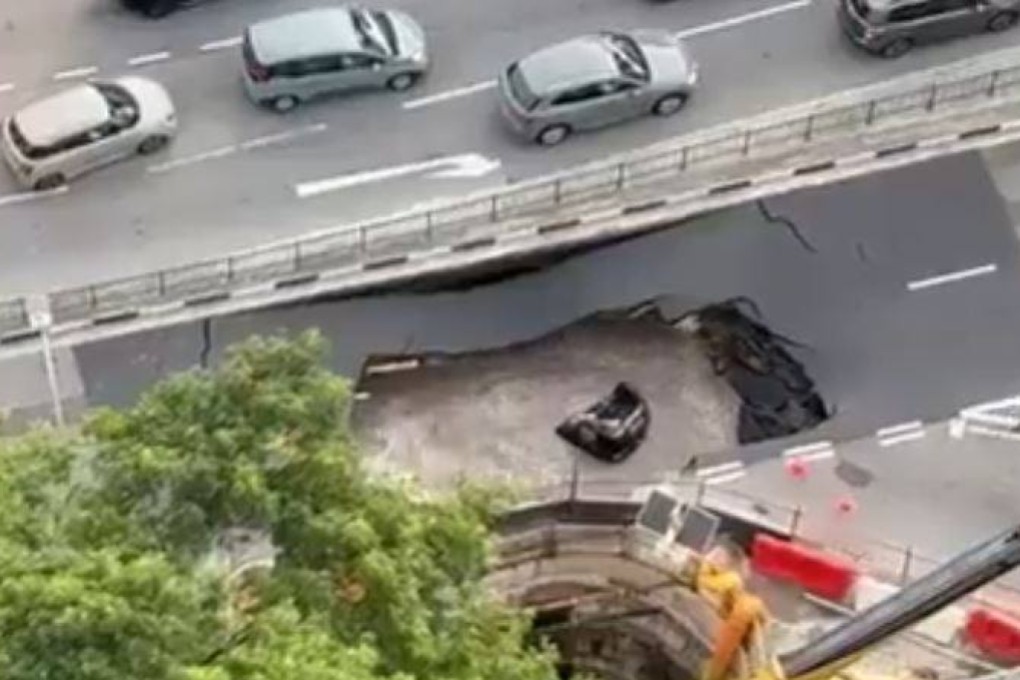 A still from a social media video shows a submerged car after it fell into a sinkhole in Singapore on July 26, 2025. Photo: X/HaggerDarren