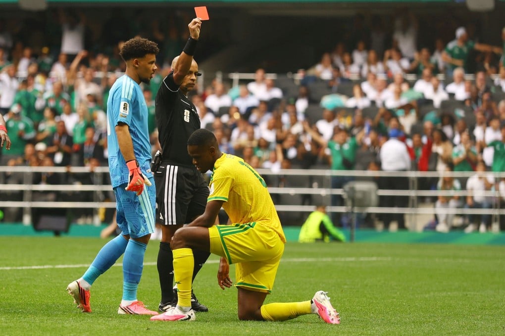 South Africa’s Sphephelo Sithole (right) is sent off by referee Wilton Sampaio. Photo: Reuters