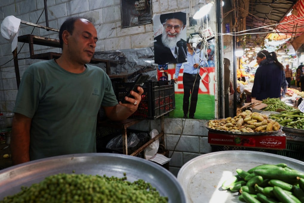 A picture of the late Iranian supreme leader Ayatollah Ali Khamenei at a store in a local market in Tehran on Thursday. Photo: via Reuters