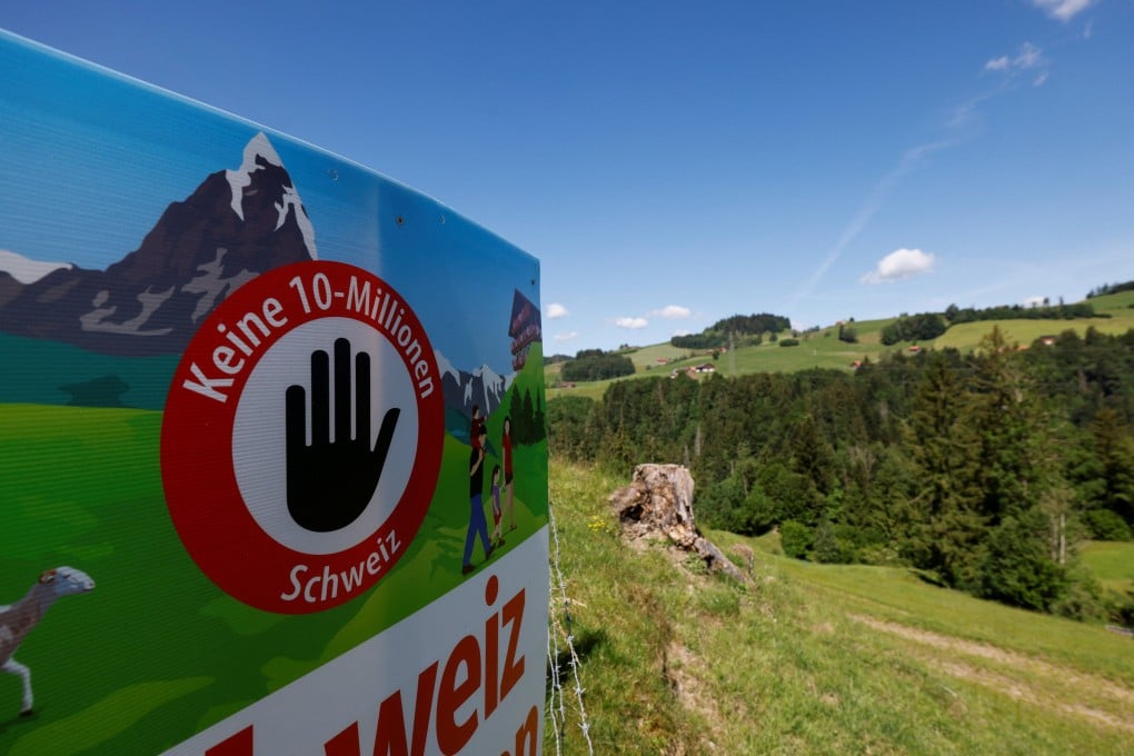 A pro-population cap sign sits in a field, on the day of the vote on a plan backed by the right-wing Swiss People’s Party (SVP) to limit population growth to 10 million inhabitants, near Hundwil, Switzerland, on Sunday. Photo: Reuters
