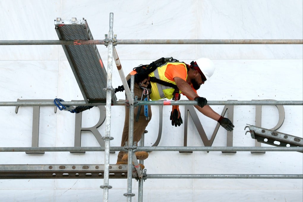 A worker constructs scaffolding in front of the Kennedy Centre in Washington on Friday. Photo: AP