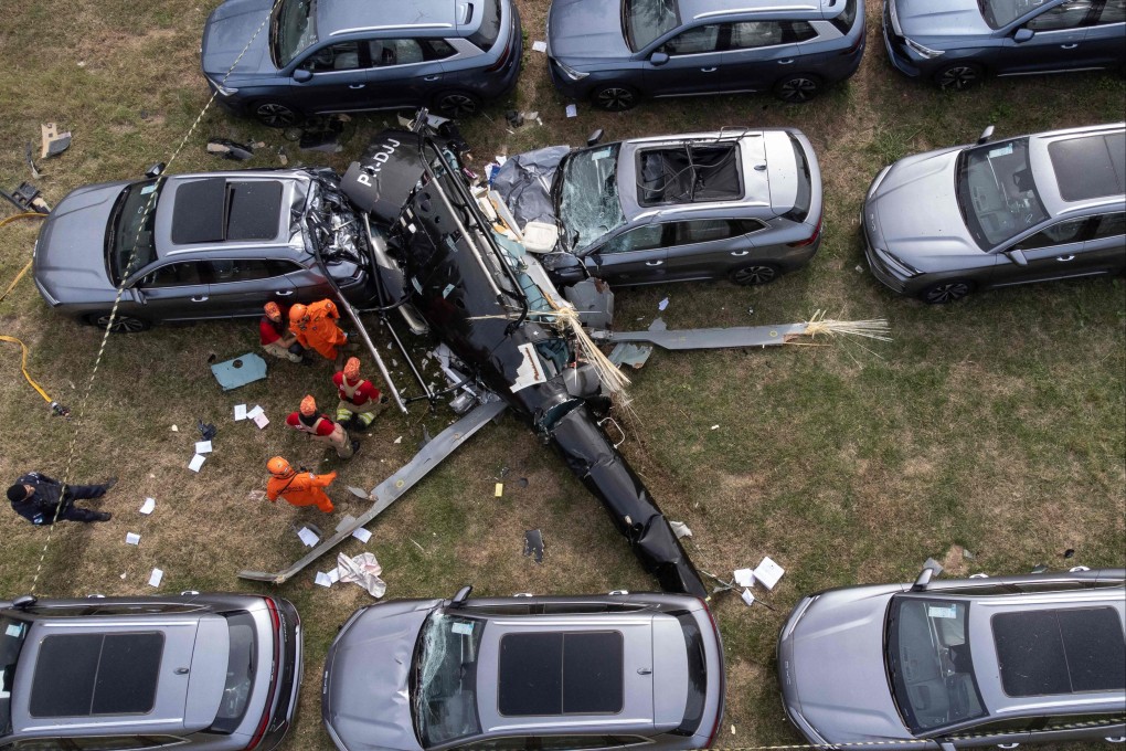 Firefighters at the site of a helicopter crash in the Recreio dos Bandeirantes neighbourhood of Rio de Janeiro, Brazil on Sunday. Photo: AFP