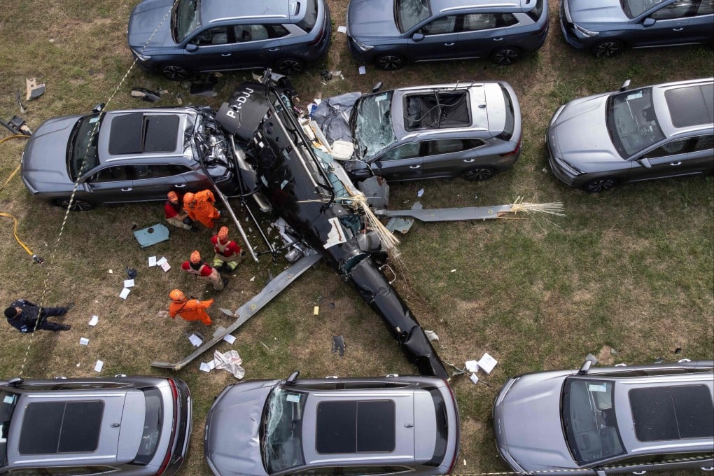 Firefighters at the site of a helicopter crash in the Recreio dos Bandeirantes neighbourhood of Rio de Janeiro, Brazil on Sunday. Photo: AFP