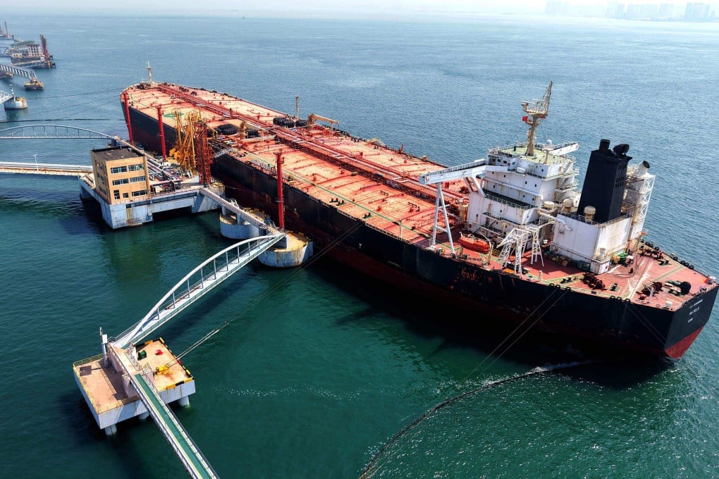 A tanker is seen unloading imported crude oil at a terminal port in China’s Shandong province on Tuesday. Photo: AFP