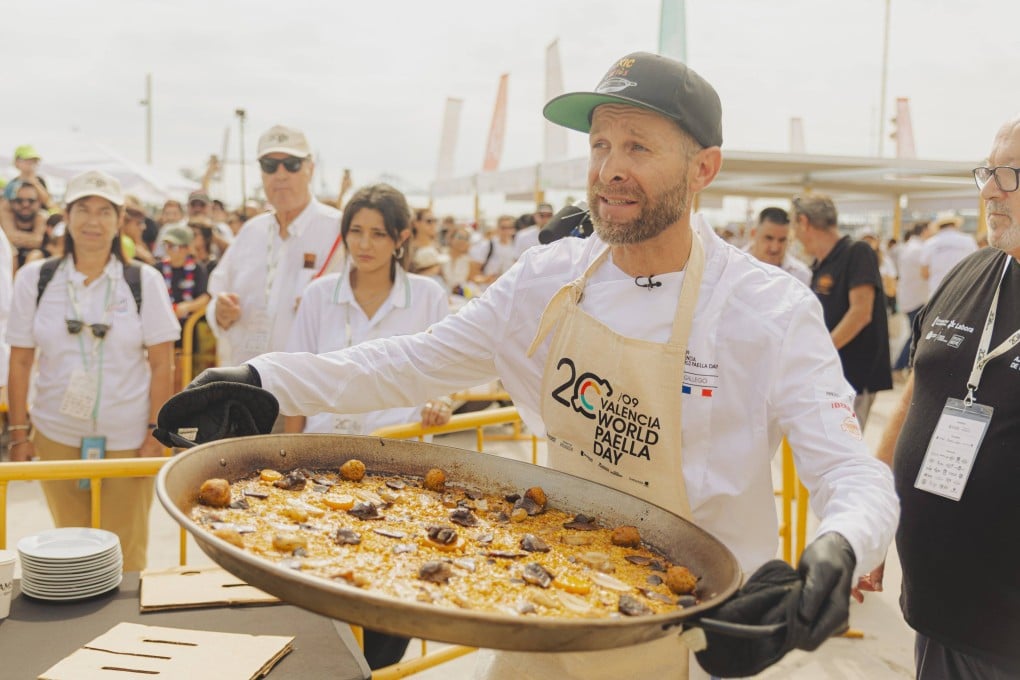 French chef Frederic Gallego holds his winning paella at the 2025 World Paella Day in Valencia. The Spanish city celebrates the rice dish in a big way, with its origins lying just a few kilometres south in the Albufera nature reserve. Photo: Santiago Vidal/Visit Valencia/dpa