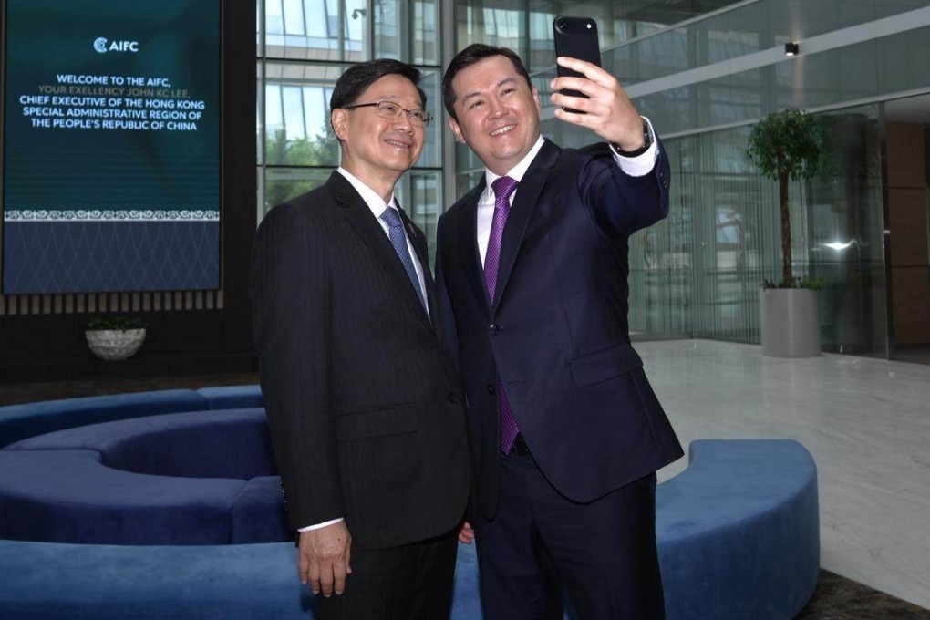 Chief Executive John Lee (left) pauses for a selfie with Astana International Financial Centre Governor Renat Bekturov at the AIFC headquarters in Astana, Kazakhstan, on June 1. Photo: Handout